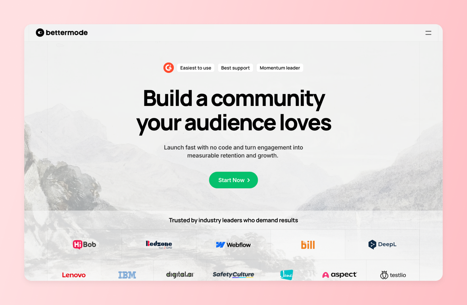 Bettermode landing page with headline "Build a community your audience loves" featuring logos of trusted companies like IBM, Lenovo, Webflow, and others against a mountain lake background