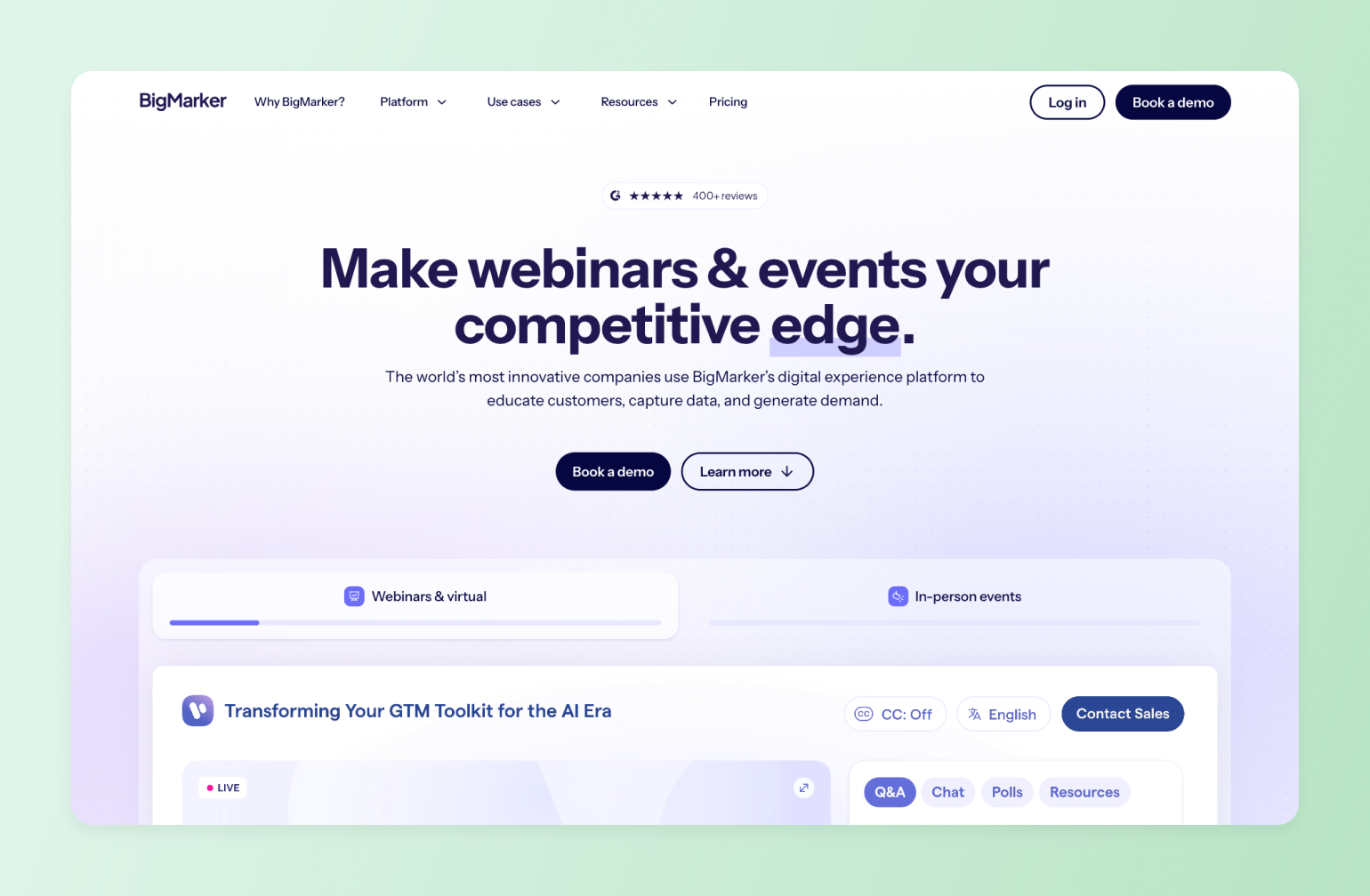 BigMarker webinar platform homepage showing headline and event interface with 400+ reviews, demo booking options, and live webinar preview