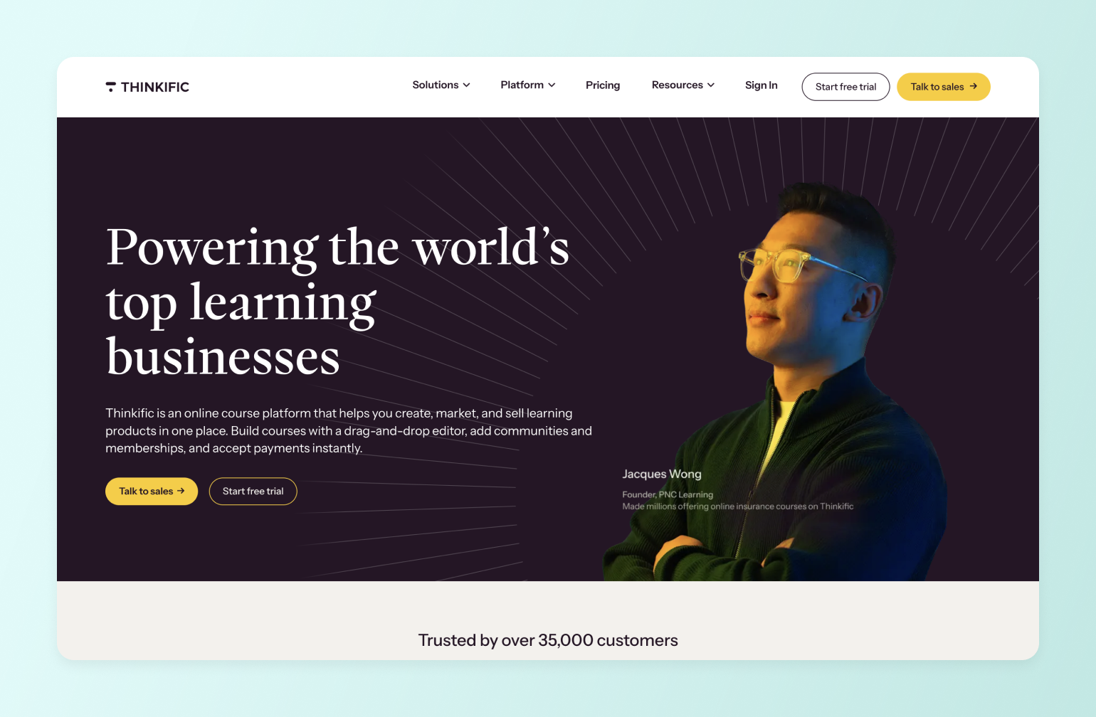 Thinkific online course platform homepage featuring Jacques Wong, Founder of PNC Learning, wearing yellow glasses against dark background with radiating lines